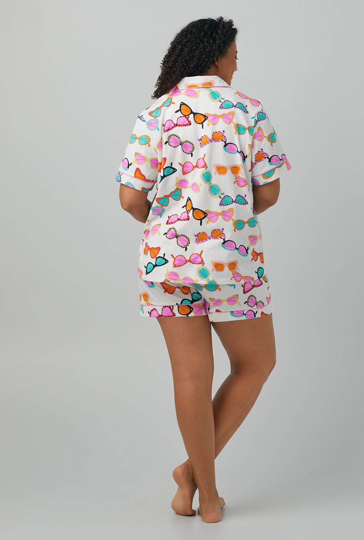 A lady wearing plus size multi color Short Sleeve Classic Shorty Stretch Jersey PJ Set with Sunny Lens print