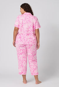 A Lady Wearing Plus Size Valentina Leopard Short Sleeve Classic Stretch Jersey Cropped Pj Set in a back view pose