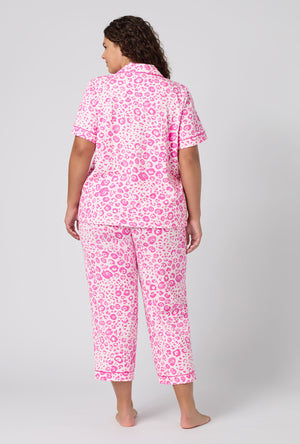 A Lady Wearing Plus Size Valentina Leopard Short Sleeve Classic Stretch Jersey Cropped Pj Set in a back view pose