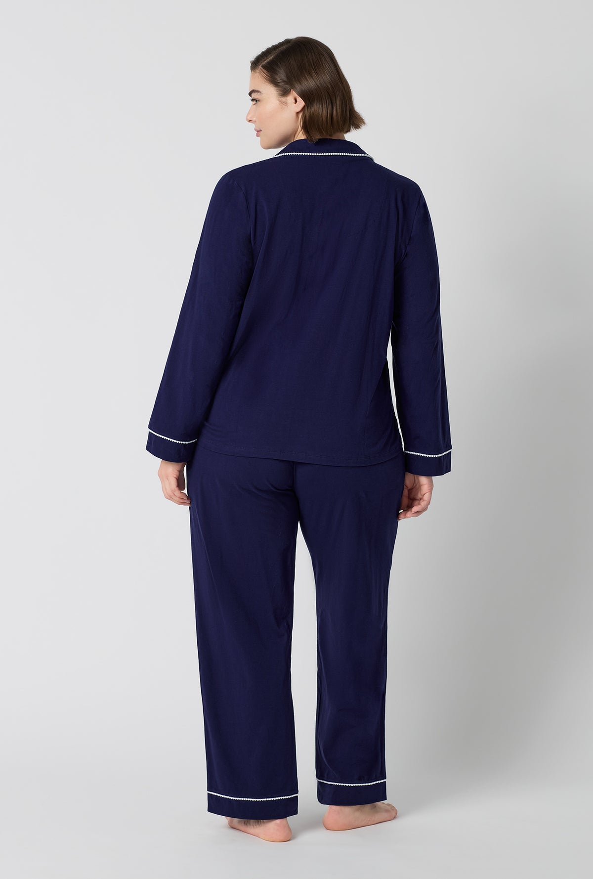 A lady wearing plus size Midnight Navy Long Sleeve Classic Stretch Jersey Pj Set back view