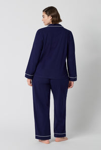 A lady wearing plus size Midnight Navy Long Sleeve Classic Stretch Jersey Pj Set back view