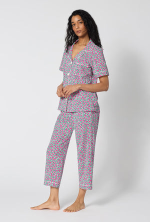 A Lady Wearing  Petite Petunias Short Sleeve Classic Stretch Jersey Cropped Pj Set in a side angled pose