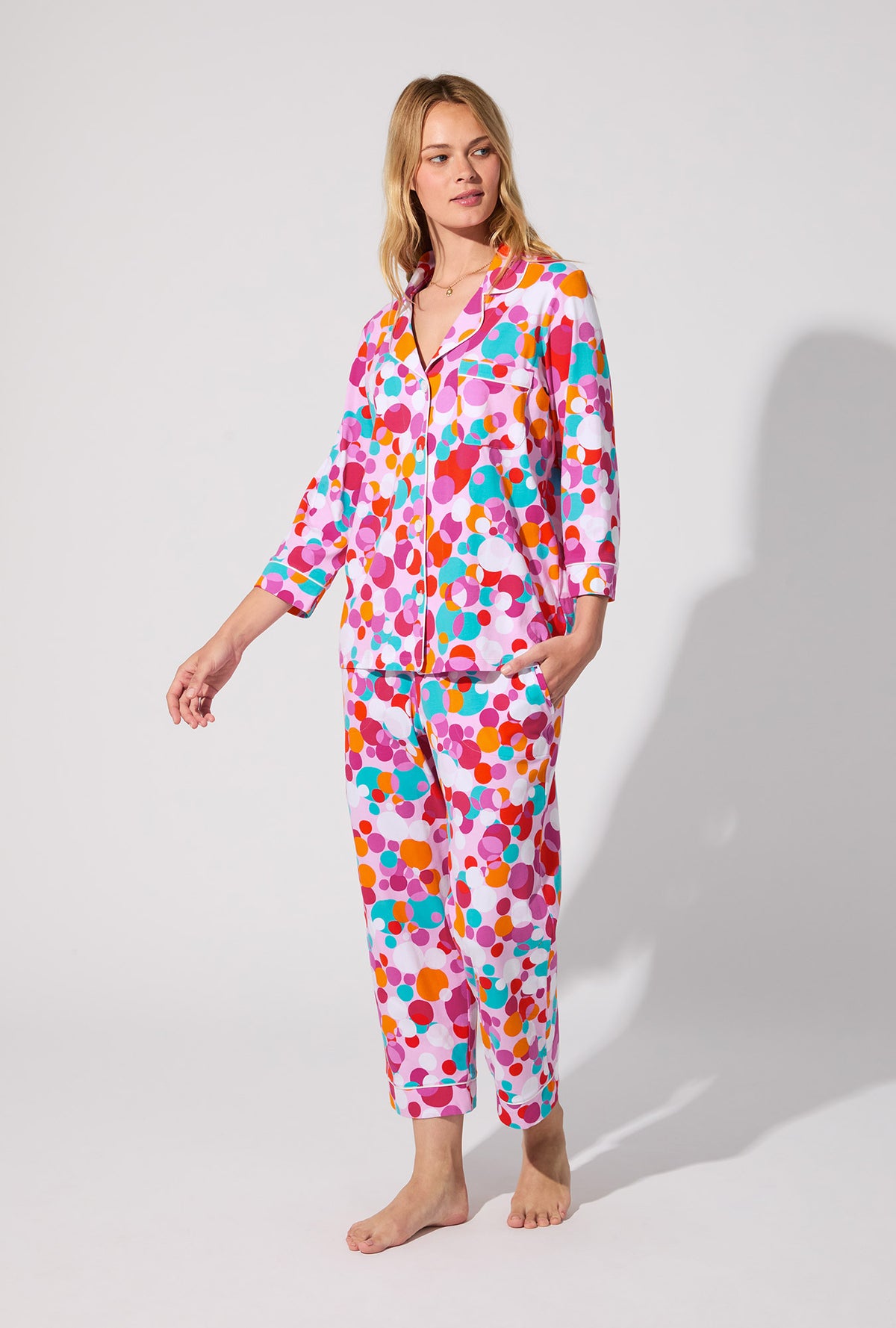 A lady wearing BedHead X Trina Turk Bubble Dots 3/4 Sleeve Classic Stretch Jersey Cropped PJ Set