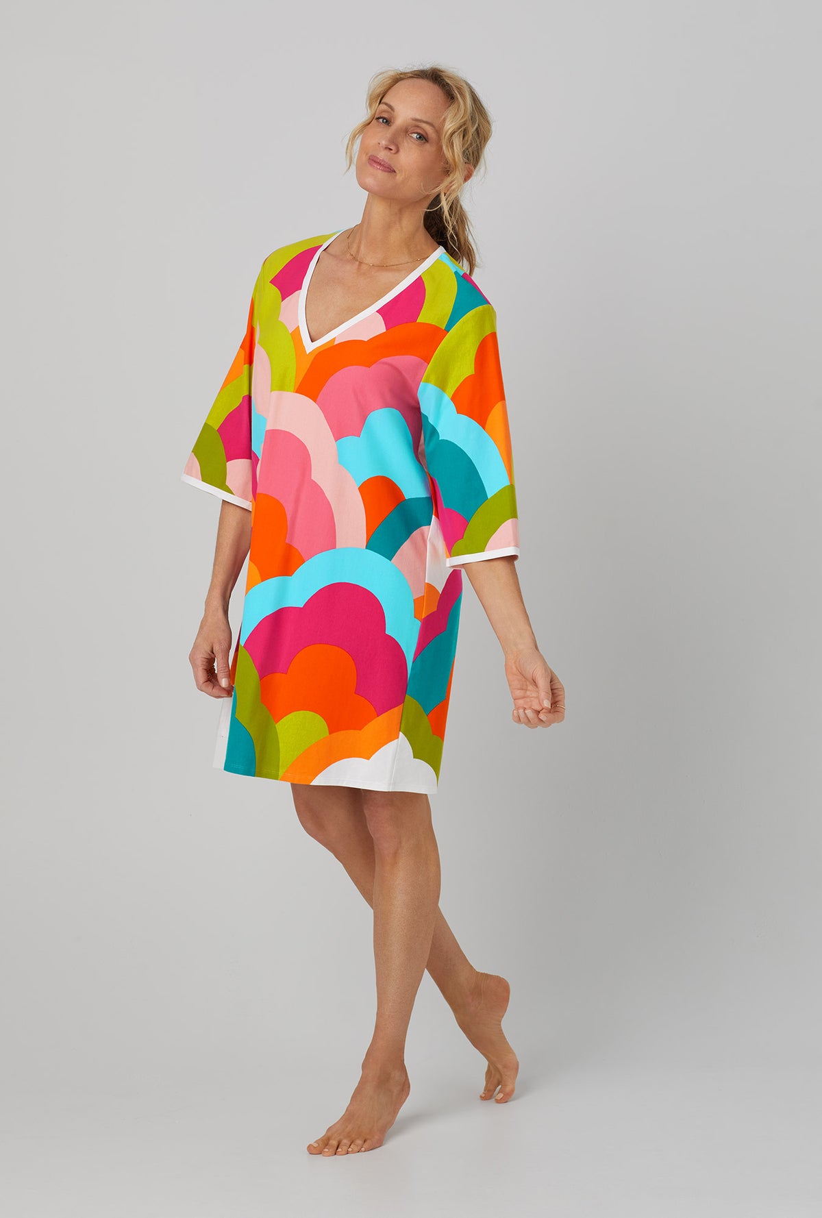 A lady wearing 3/4 Sleeve Classic Stretch Jersey Caftan with rainbow cloud print