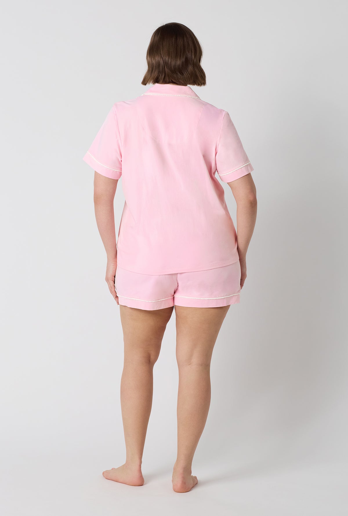 A lady wearing plus size Pink Powder Short Sleeve Classic Shorty Stretch Jersey Pj Set back view
