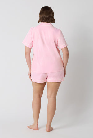 A lady wearing plus size Pink Powder Short Sleeve Classic Shorty Stretch Jersey Pj Set back view