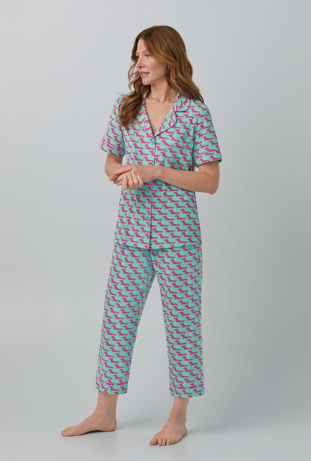A lady wearing  Short Sleeve Classic Stretch Jersey Cropped PJ Set with Dog Walk  print