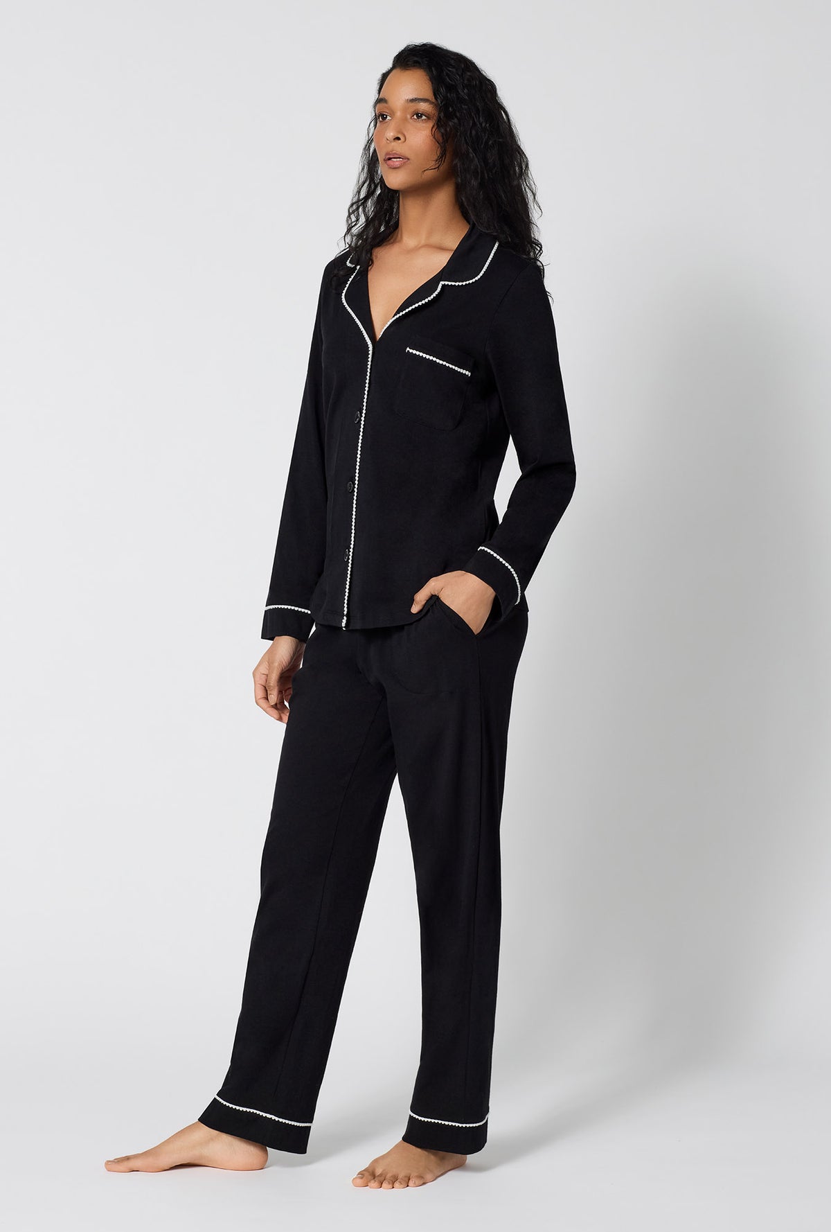 A lady wearing Black Beauty Long Sleeve Classic Stretch Jersey Pj Set looking side