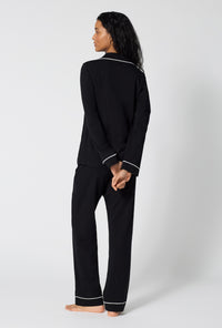 A lady wearing Black Beauty Long Sleeve Classic Stretch Jersey Pj Set back view