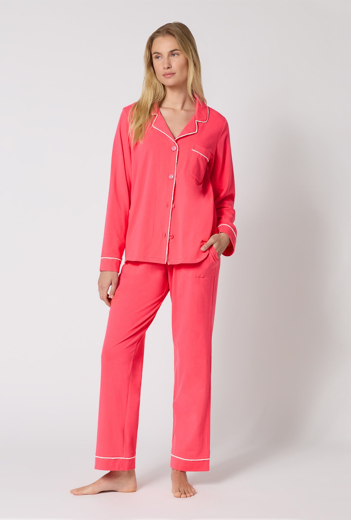 A lady wearing Coral Red Long Sleeve Classic Stretch Jersey Pj Set looking side