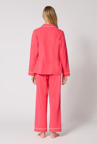 A lady wearing Coral Red Long Sleeve Classic Stretch Jersey Pj Set back view