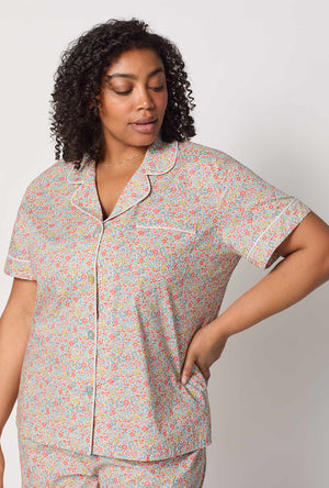 A closeup of A lady wearing plus size Emma & Georgina Short Sleeve Classic Shorty Woven Tana Lawn® PJ Set Made with Liberty Fabric