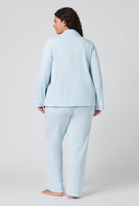 A lady wearing plus size Blissful Blue Long Sleeve Classic Stretch Jersey Pj Set back view
