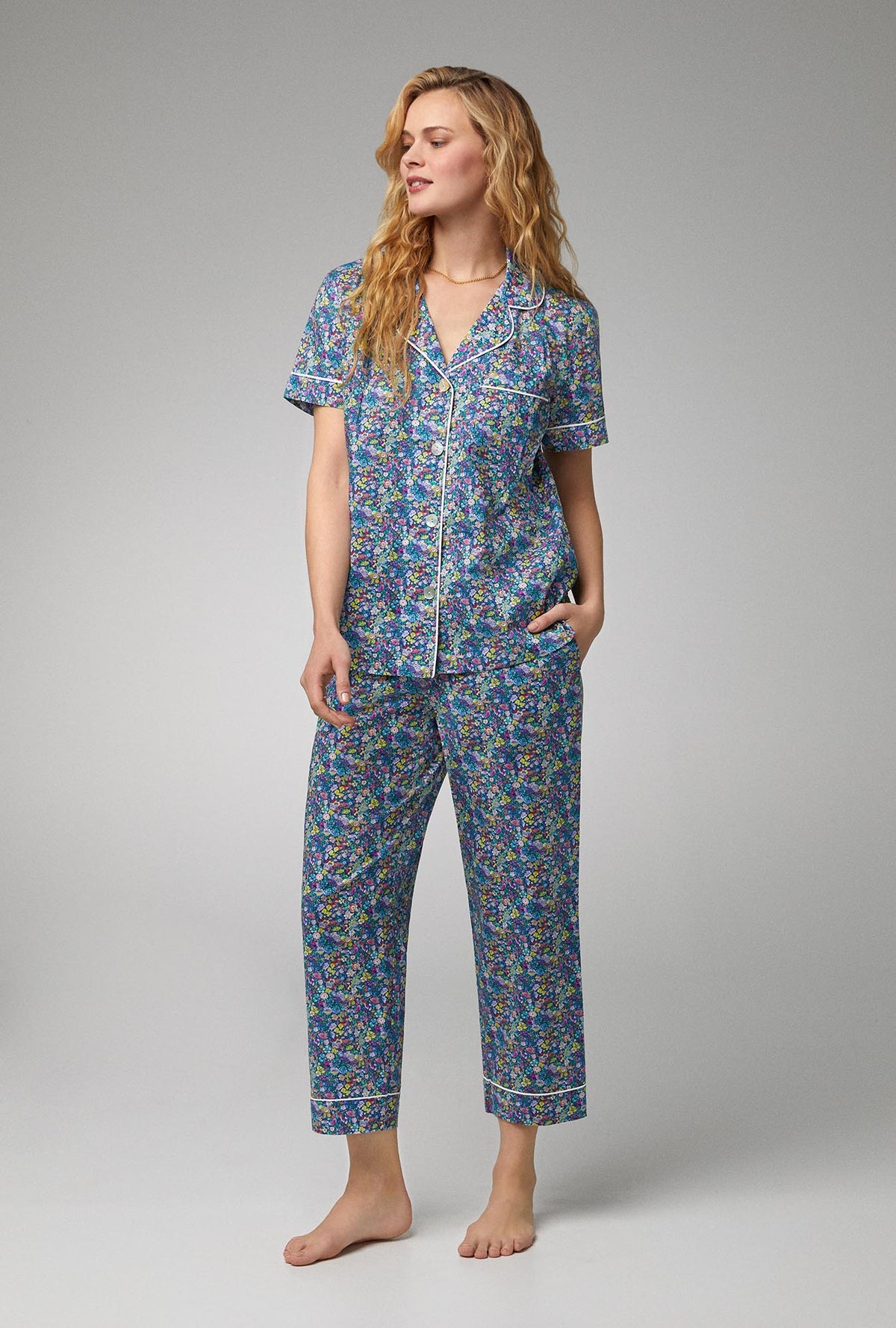 A lady wearing short sleeve classic cropped pj set with classic garden print