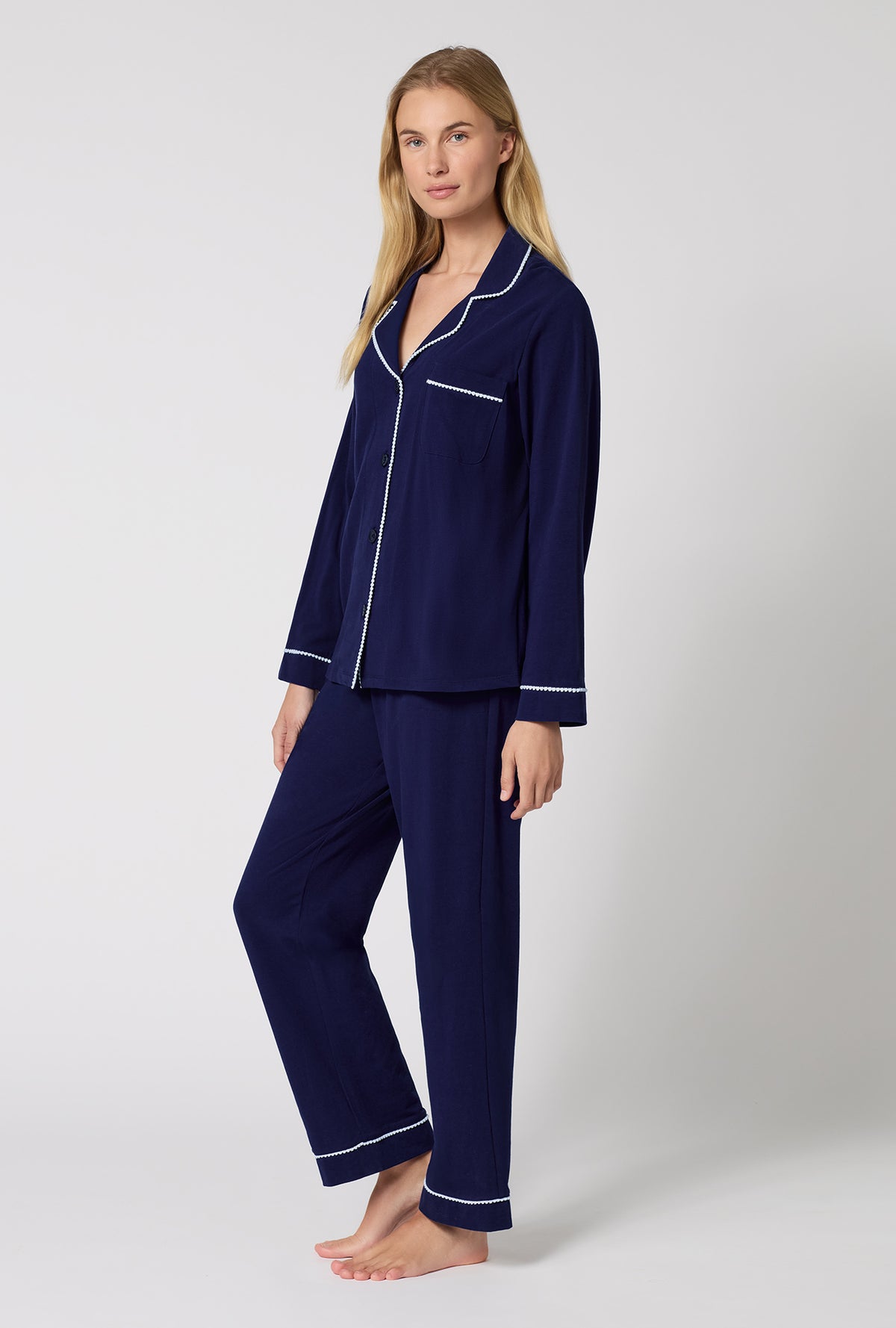 A lady wearing Midnight Navy Long Sleeve Classic Stretch Jersey Pj Set looking side
