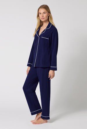A lady wearing Midnight Navy Long Sleeve Classic Stretch Jersey Pj Set looking side
