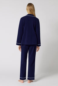 A lady wearing Midnight Navy Long Sleeve Classic Stretch Jersey Pj Set back view