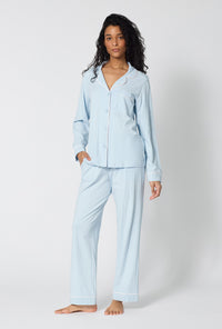 A lady wearing Blissful Blue Long Sleeve Classic Stretch Jersey Pj Set looking front