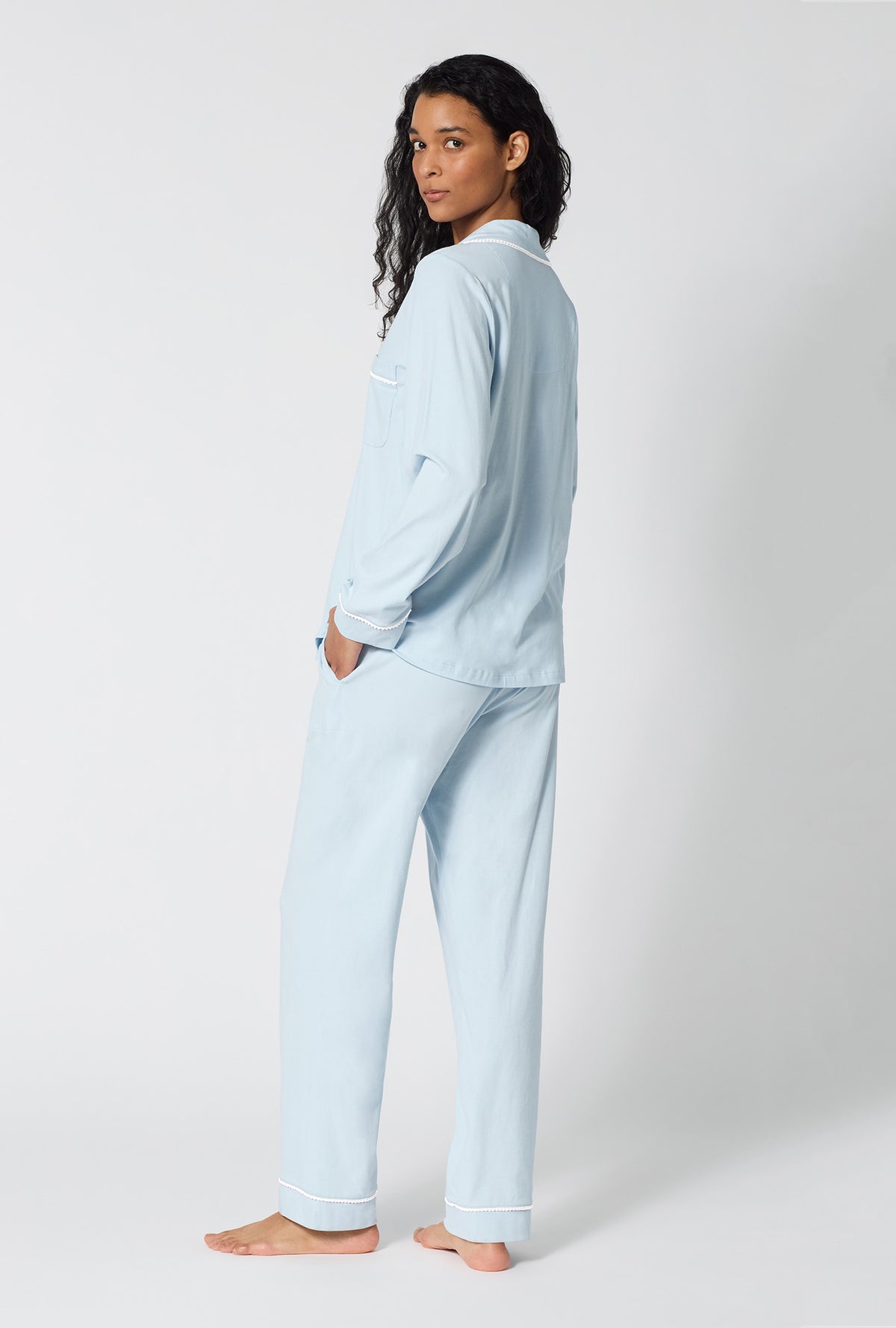 A lady wearing Blissful Blue Long Sleeve Classic Stretch Jersey Pj Set back view