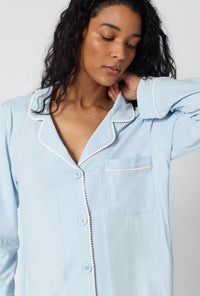A lady wearing Blissful Blue Long Sleeve Classic Stretch Jersey Pj Set closer look