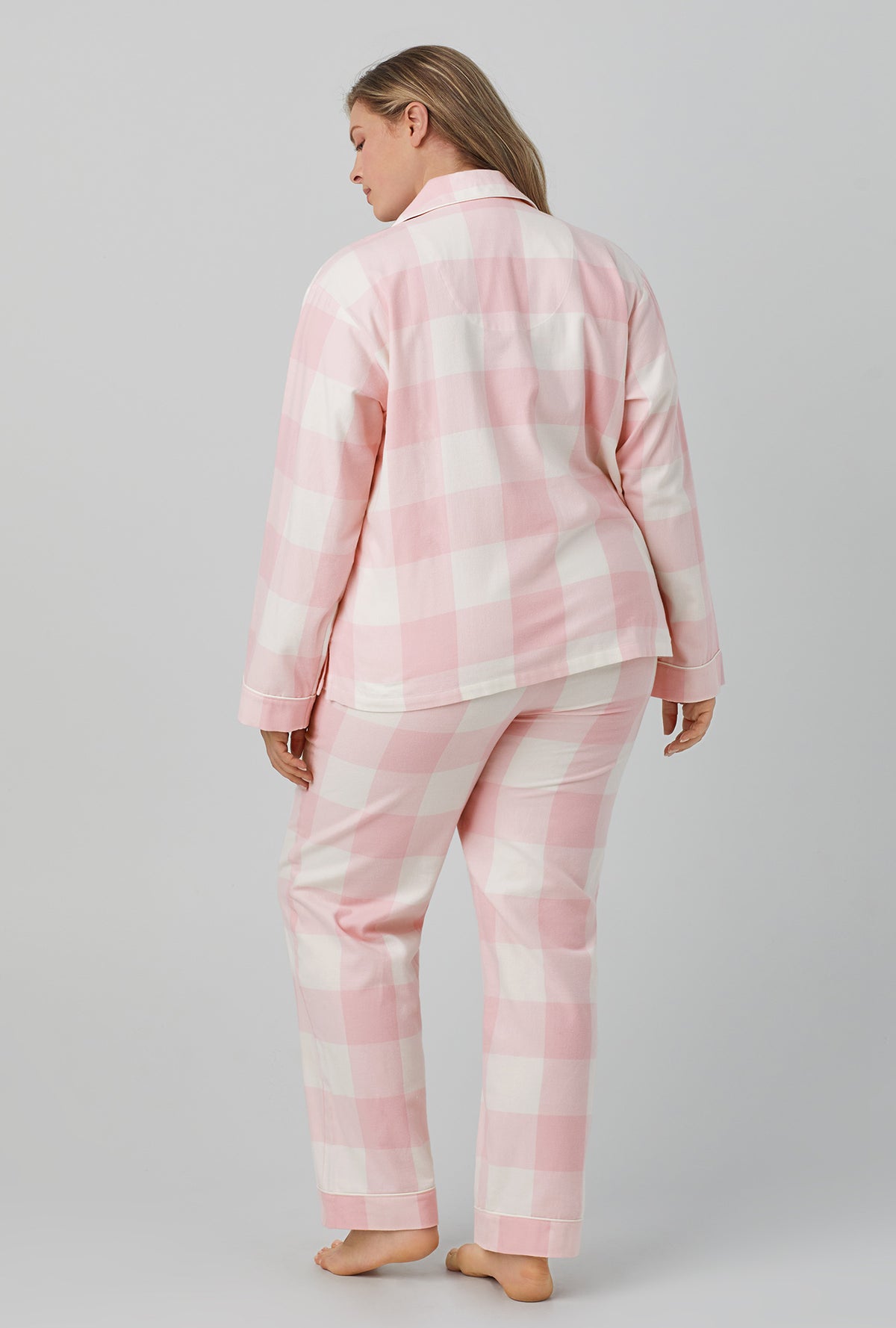 A lady wearing long sleeve classic flannel twill pj set with checking in print