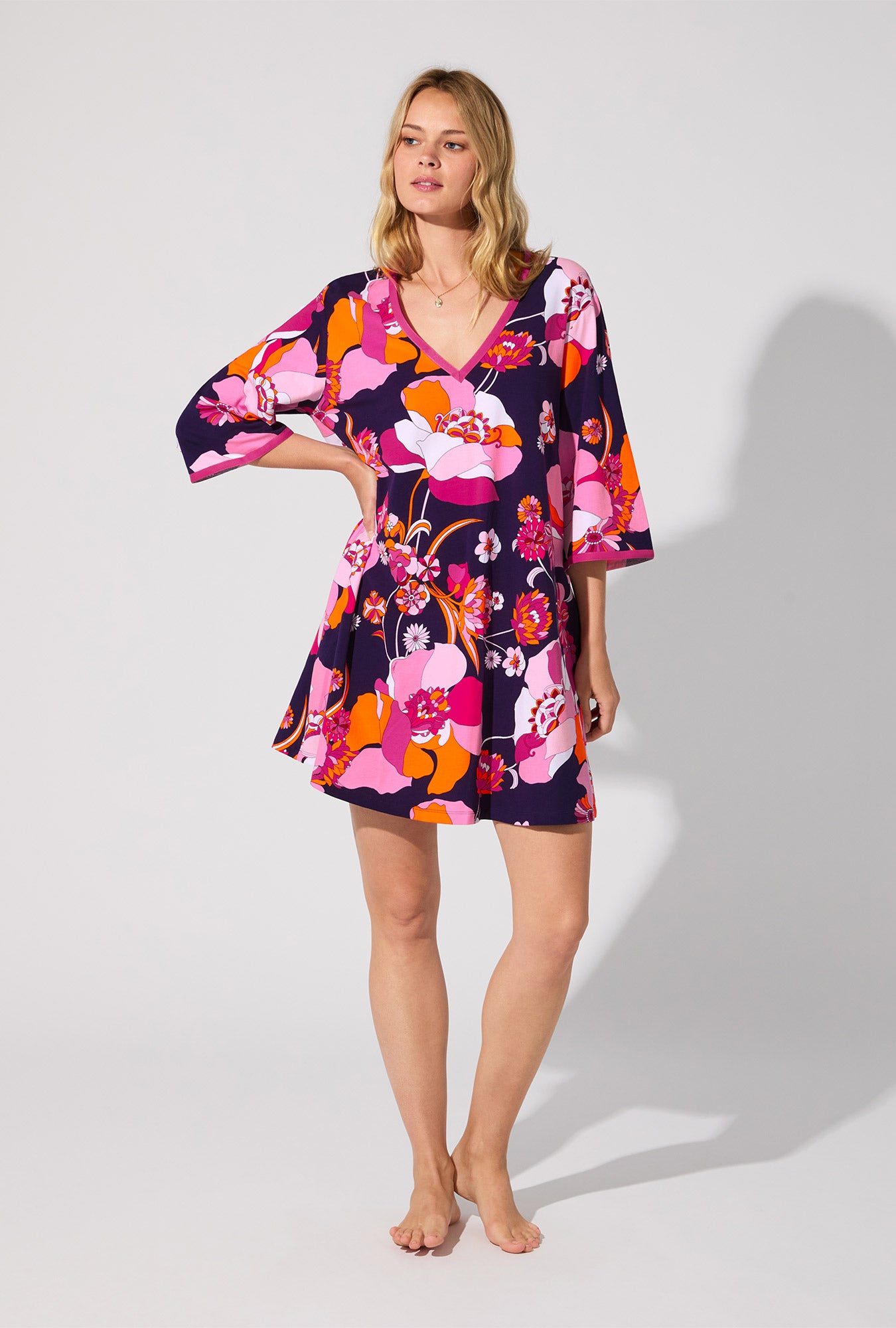 A lady wearing BedHead X Trina Turk Floral Medley 3/4 Sleeve Stretch Jersey Caftan