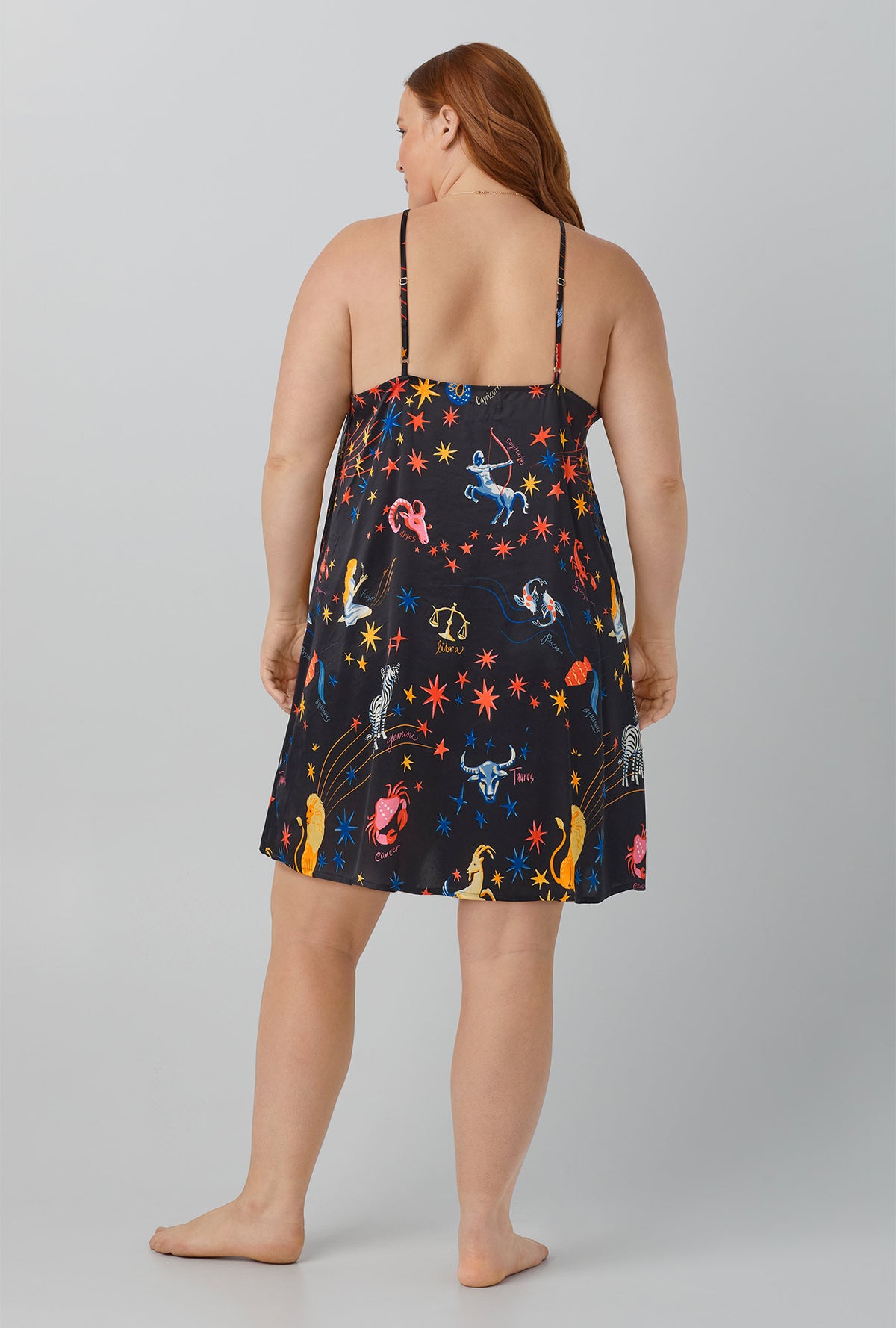 A lady wearing black Washable Silk Satin Chemise with Celestial Dreams print