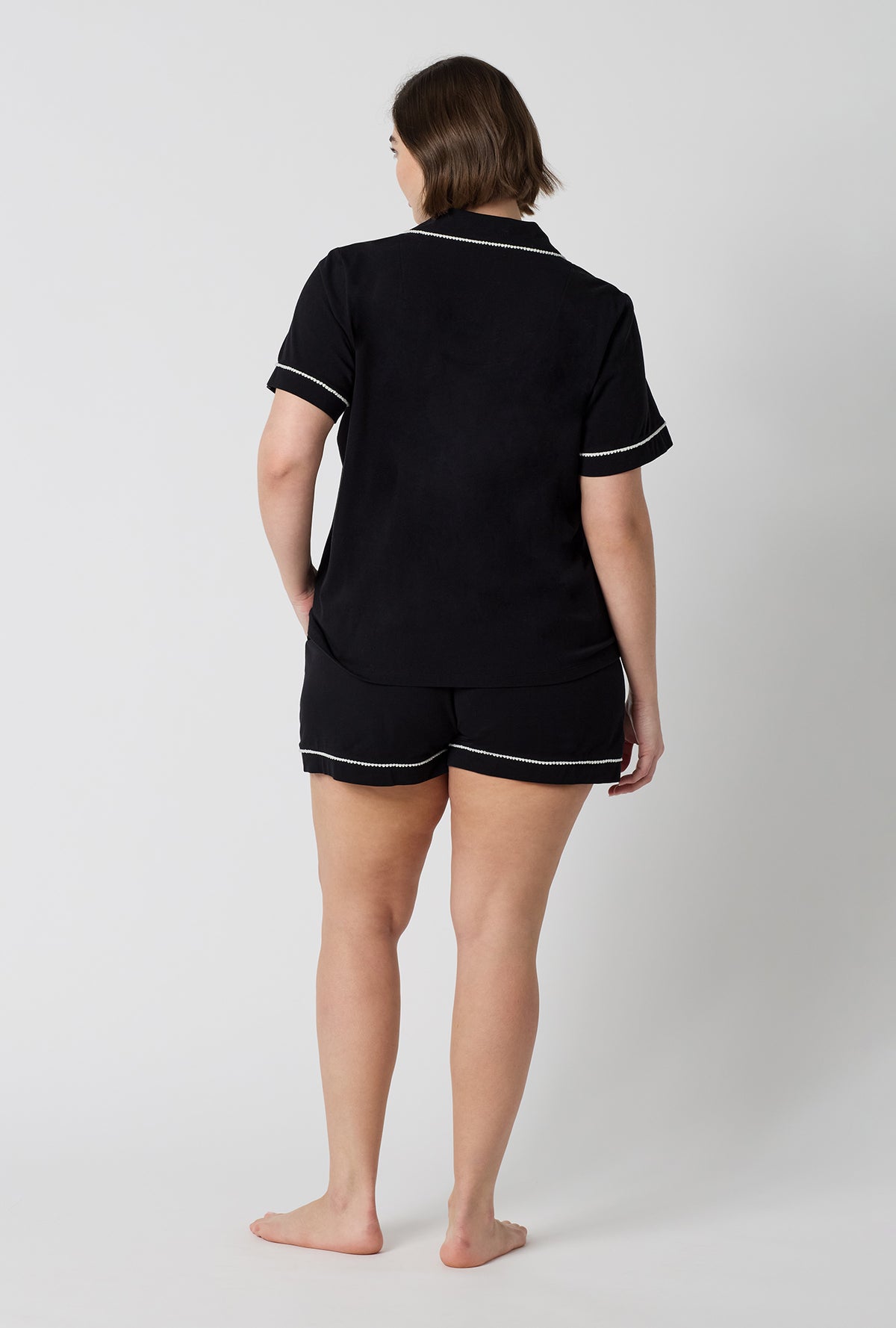 A lady wearing plus size Black Beauty Short Sleeve Classic Shorty Stretch Jersey Pj Set back view