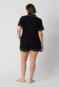 A lady wearing plus size Black Beauty Short Sleeve Classic Shorty Stretch Jersey Pj Set back view