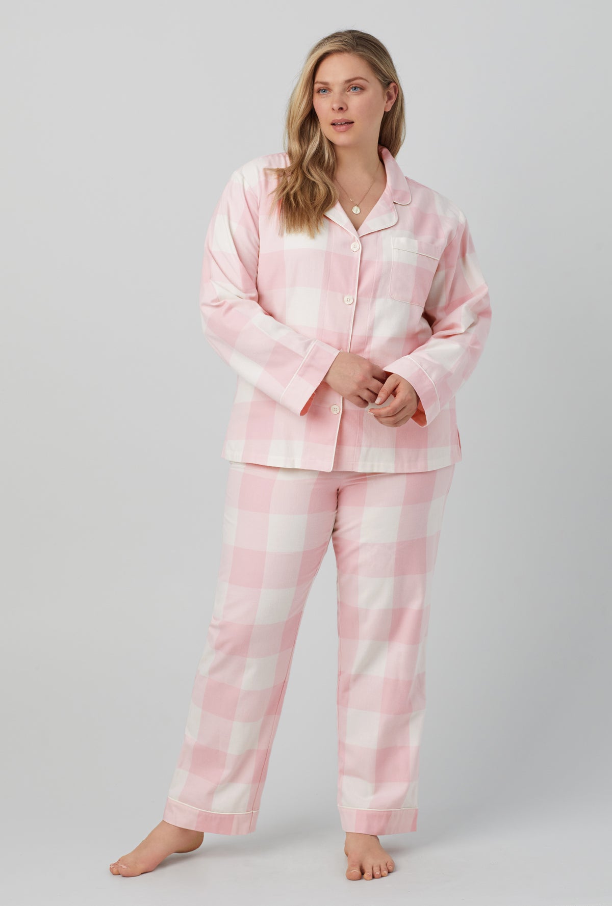 A lady wearing long sleeve classic flannel twill pj set with checking in print