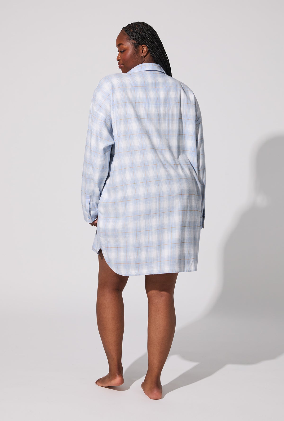A lady wearing Blue Mountain Plaid High Low Woven Portuguese Flannel Boyfriend Shirt