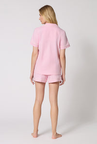 A lady wearing Pink Powder Short Sleeve Classic Shorty Stretch Jersey Pj Set back view