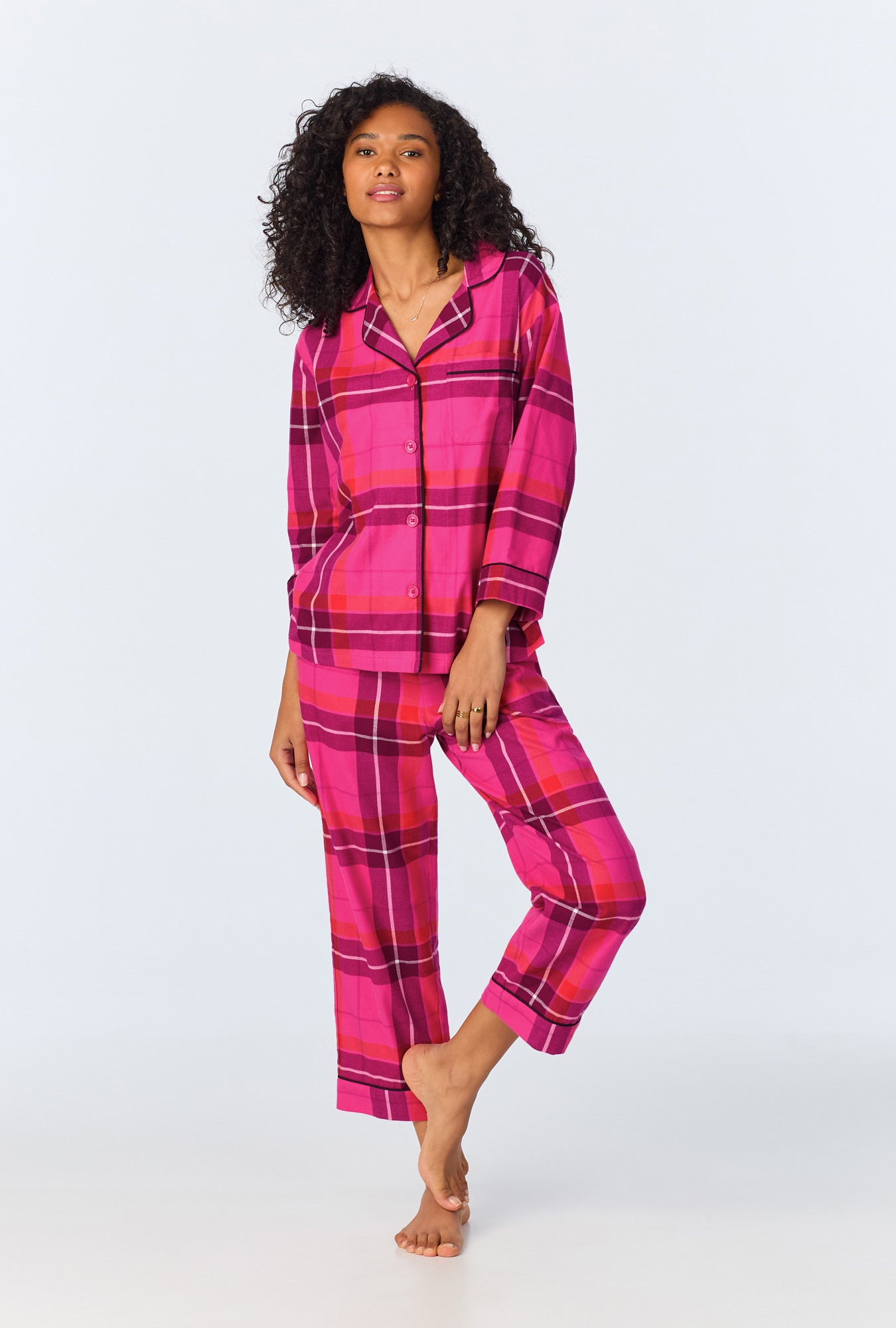 A lady wearing Aurora Plaid 3/4 Sleeve Classic Stretch Jersey Cropped PJ Set