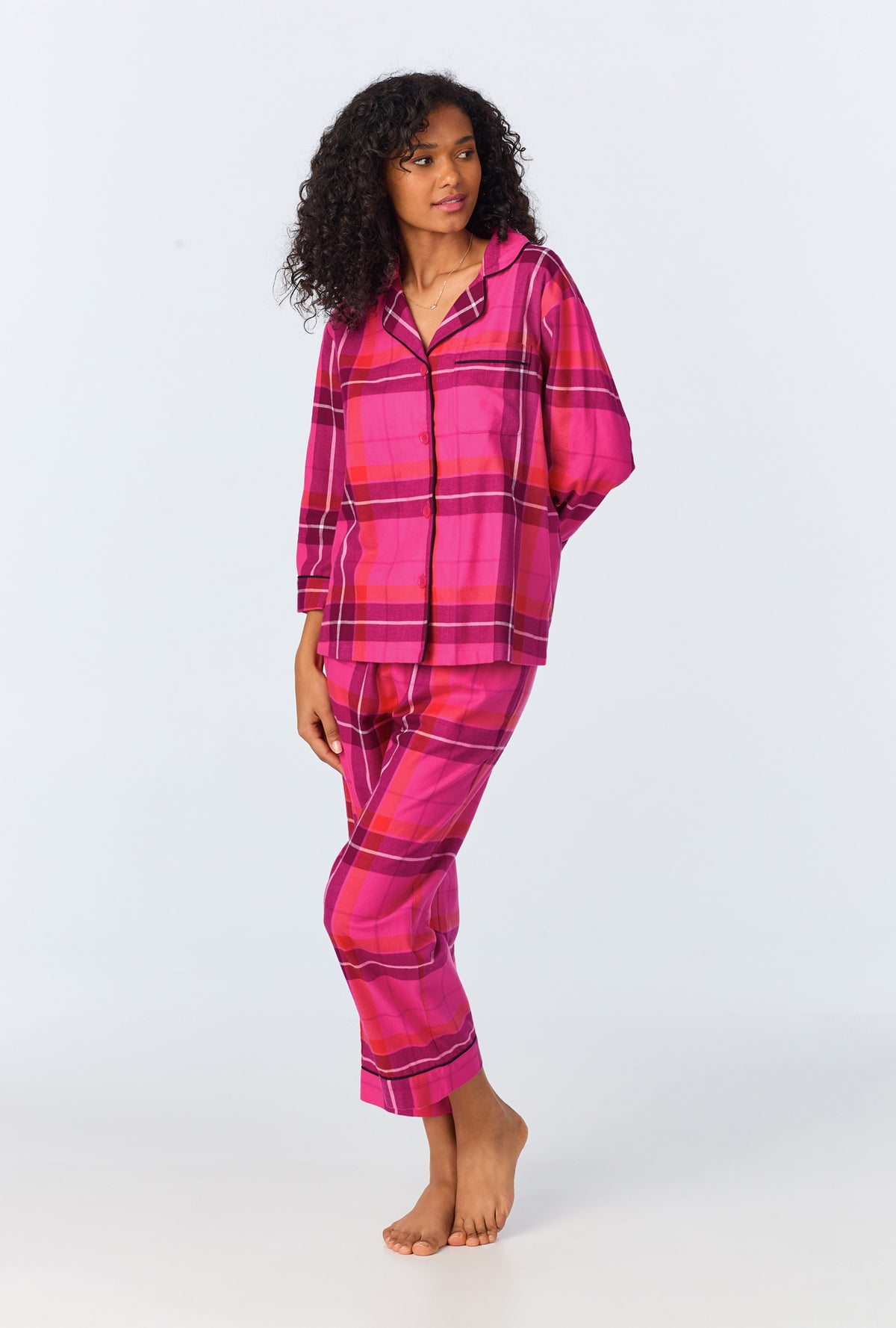 A lady wearing Aurora Plaid 3/4 Sleeve Classic Stretch Jersey Cropped PJ Set