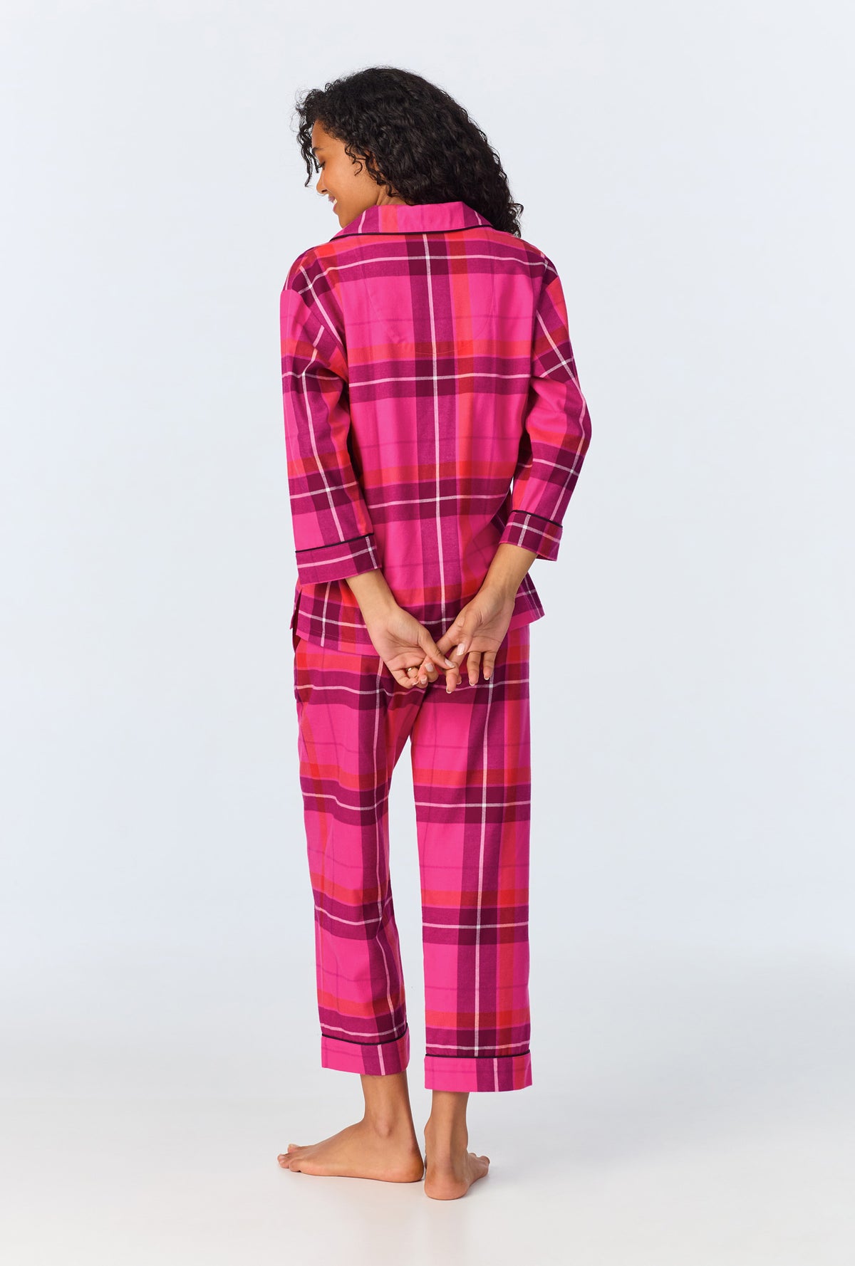 A lady wearing Aurora Plaid 3/4 Sleeve Classic Stretch Jersey Cropped PJ Set