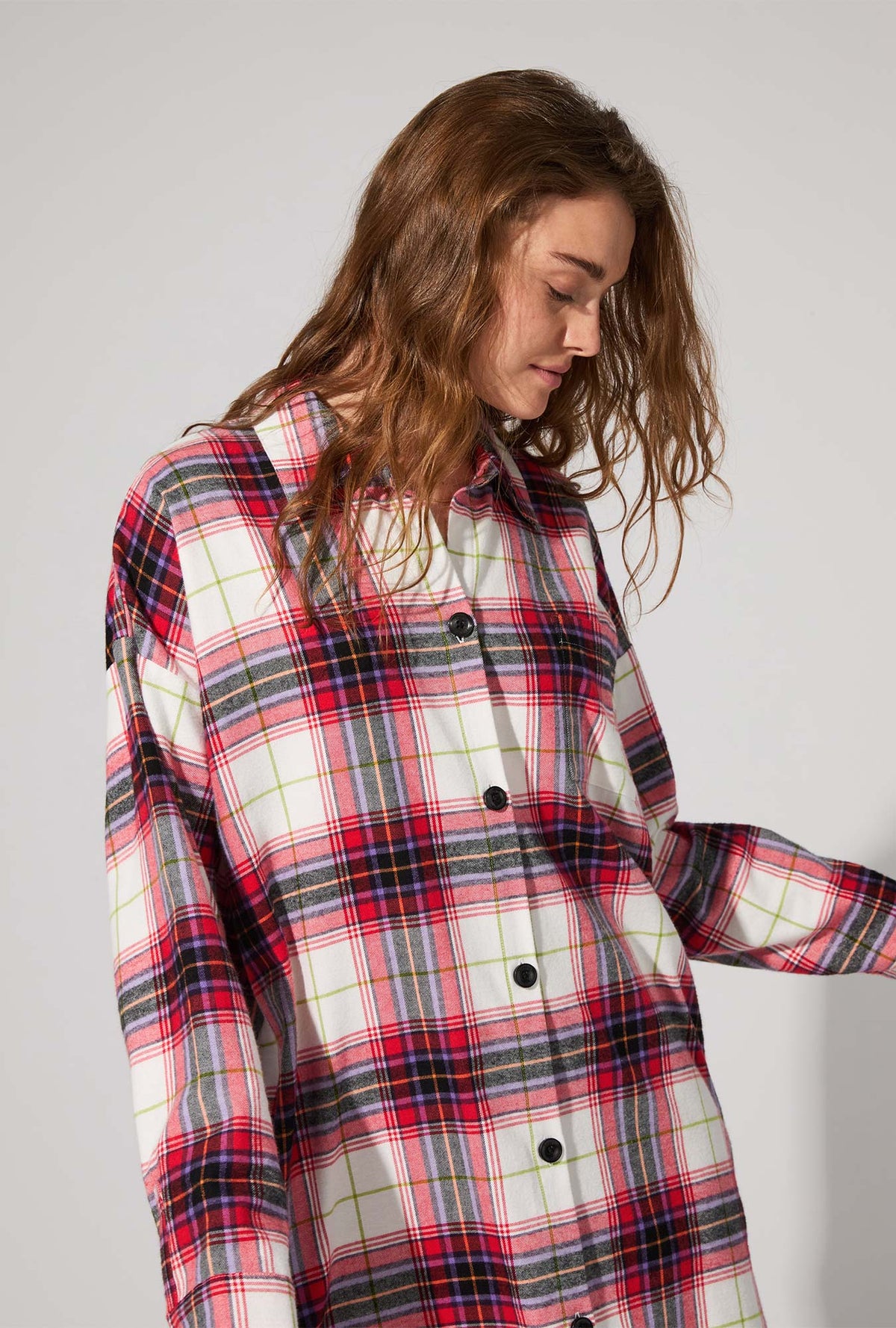 A lady wearing Equestrian Plaid High Low Woven Portuguese Flannel Boyfriend Shirt