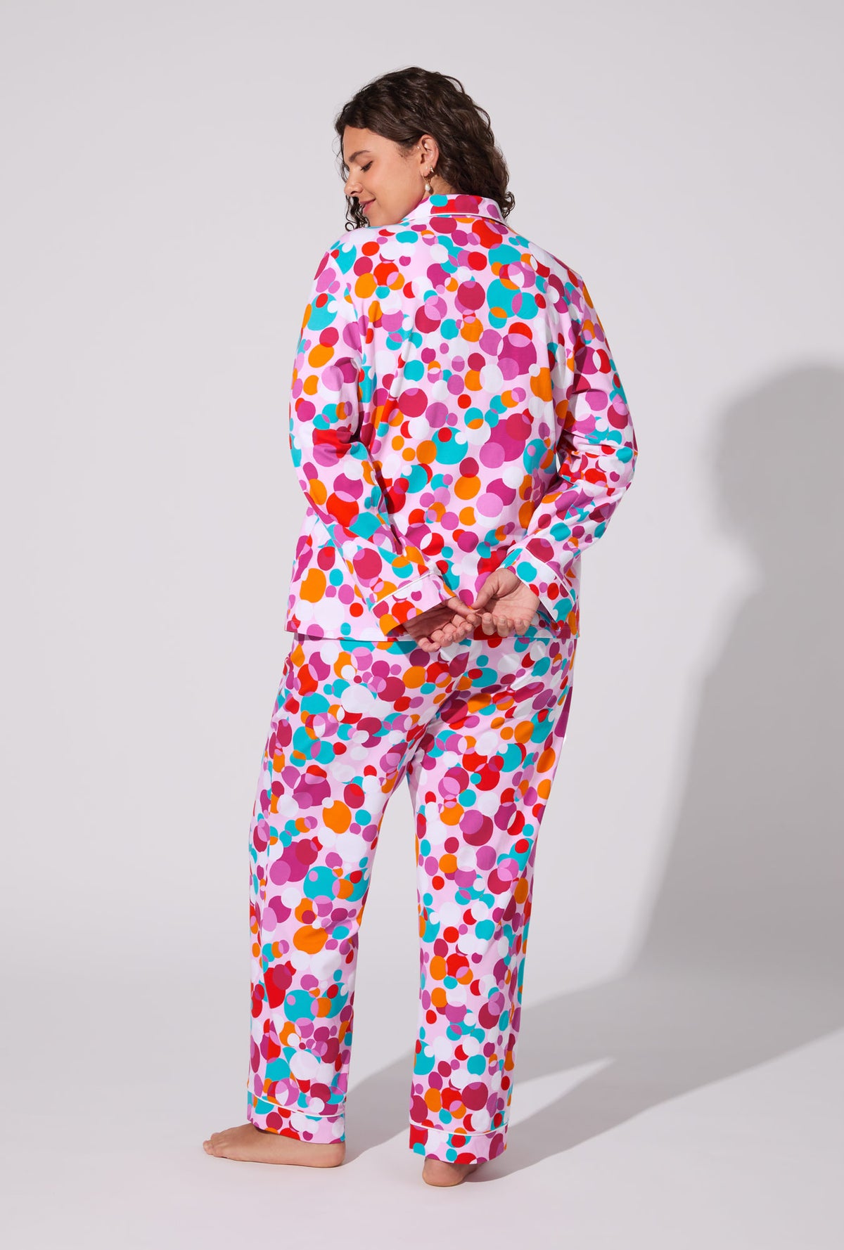 A lady wearing BedHead X Trina Turk Bubble Dots Long Sleeve Classic Stretch Jersey PJ Set