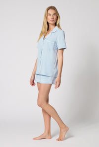 A lady wearing Blissful Blue Short Sleeve Classic Shorty Stretch Jersey Pj Set