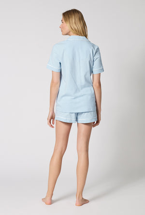 A lady wearing Blissful Blue Short Sleeve Classic Shorty Stretch Jersey Pj Set back view