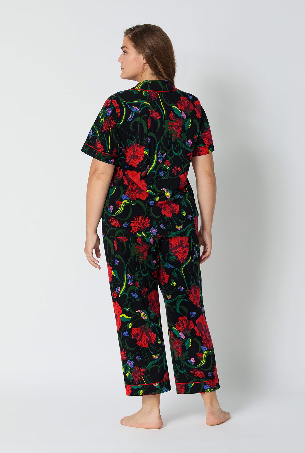 A lady wearing BedHead X Trina Turk Haute Floral Short Sleeve Classic Stretch Jersey Cropped Pj Set