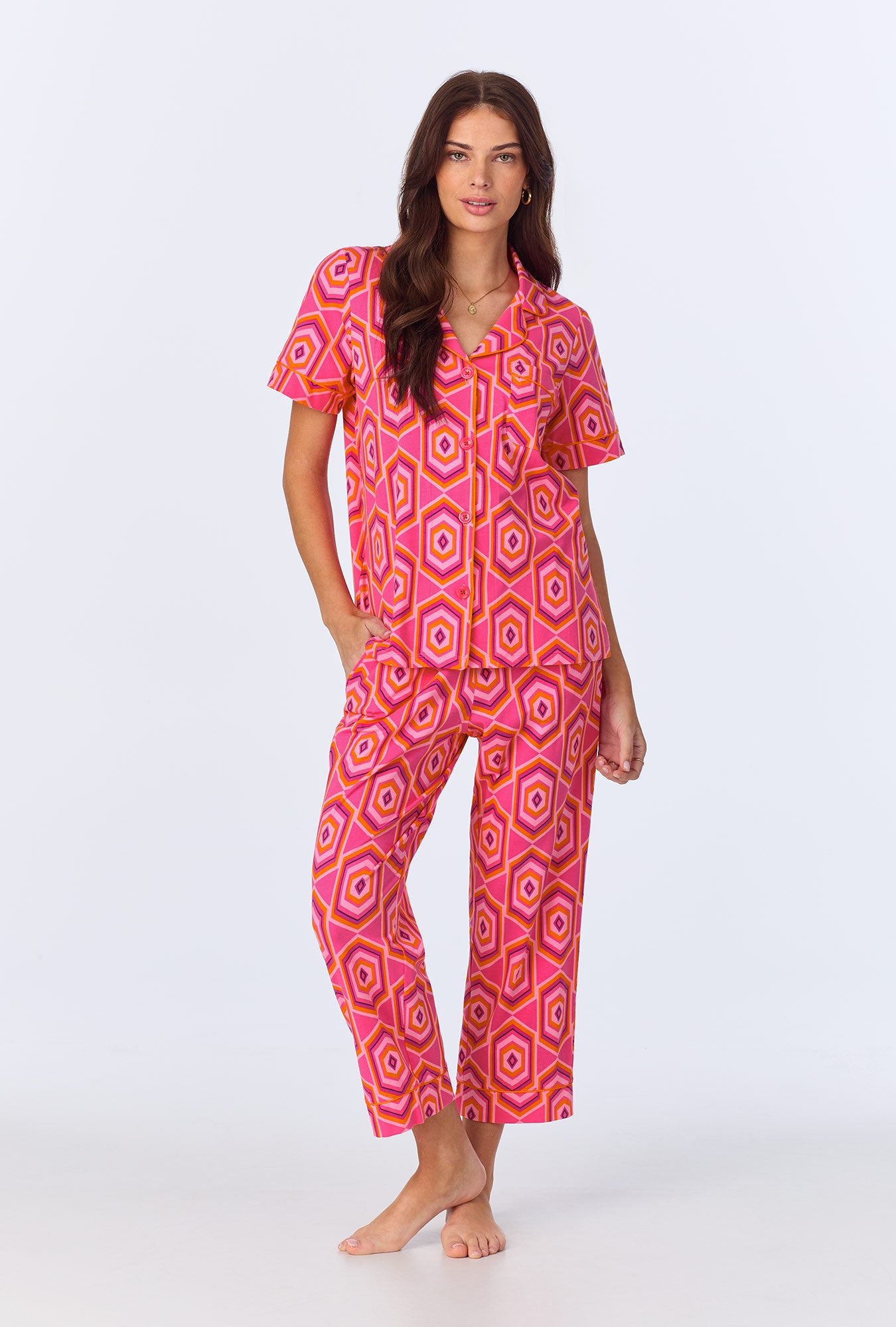 A lady wearing BedHead x Trina Turk Multi Hexagon Short Sleeve Classic Stretch Jersey Cropped PJ Set