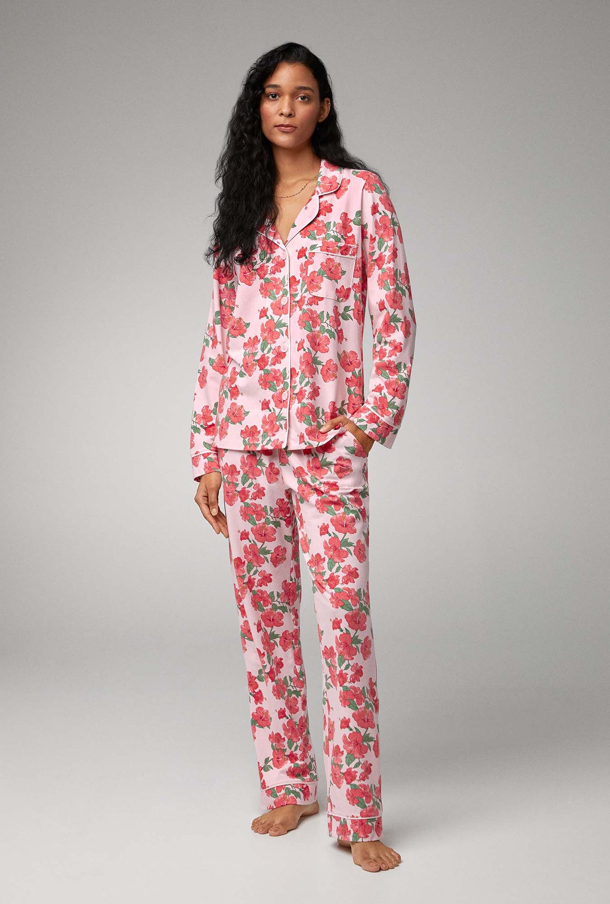 A lady wearing pink long sleeve classic stretch jersey pj set with sweer hibisus.