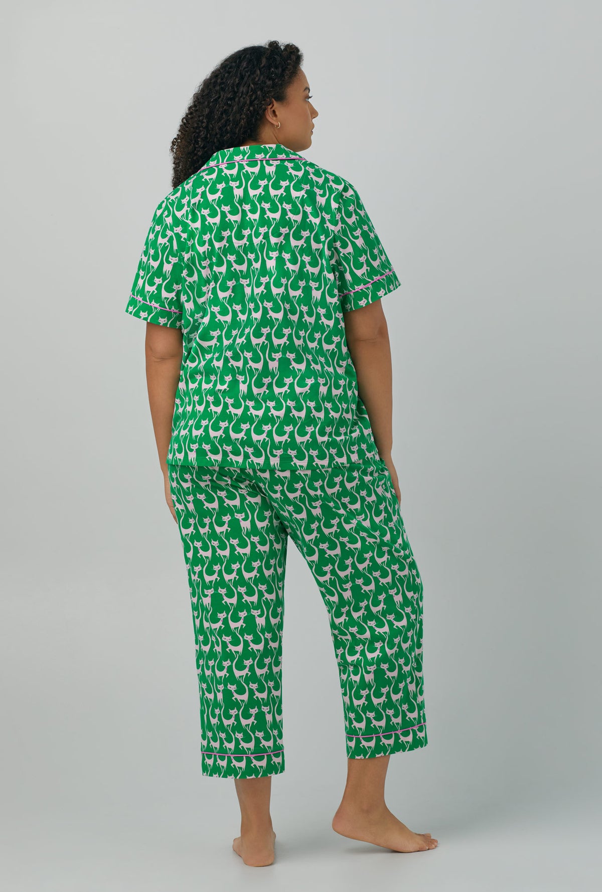 A lady wearing green plus size Short Sleeve Classic Stretch Jersey Cropped with Cool Cats print