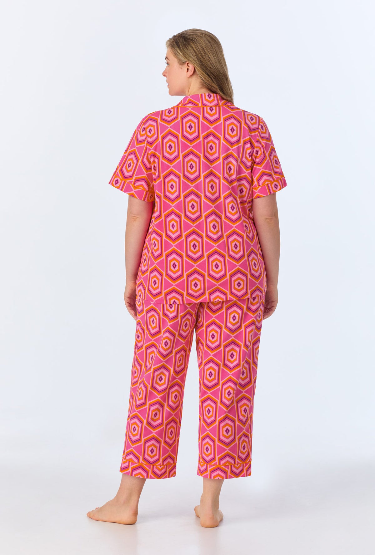 A lady wearing BedHead x Trina Turk Multi Hexagon Short Sleeve Classic Stretch Jersey Cropped PJ Set