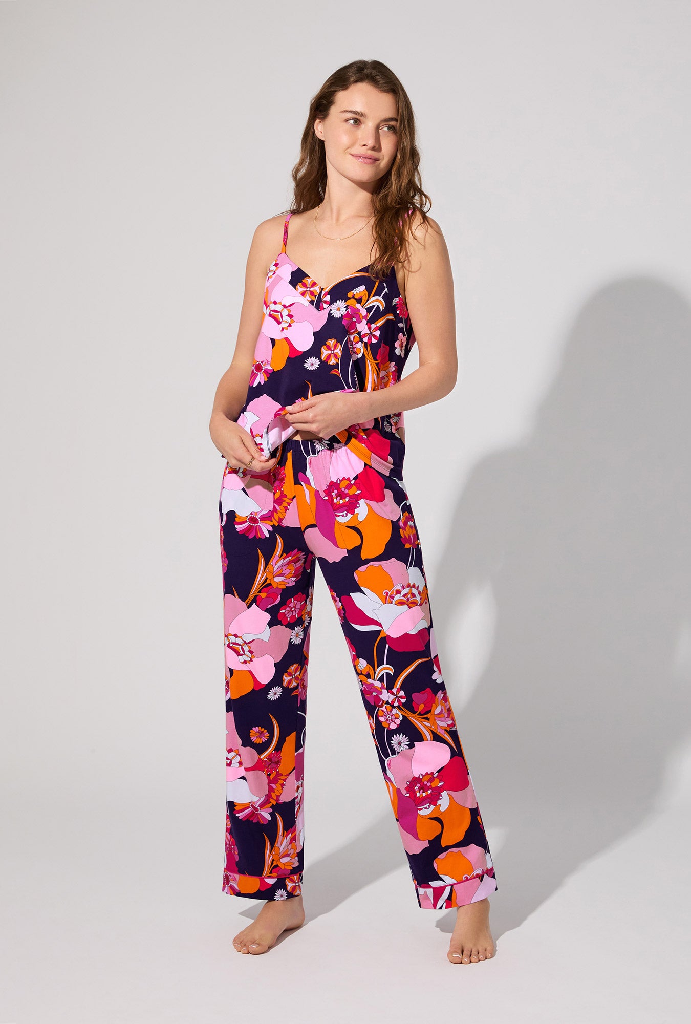 A lady wearing BedHead X Trina Turk Floral Medley Cami Tank Stretch Jersey Long PJ Set