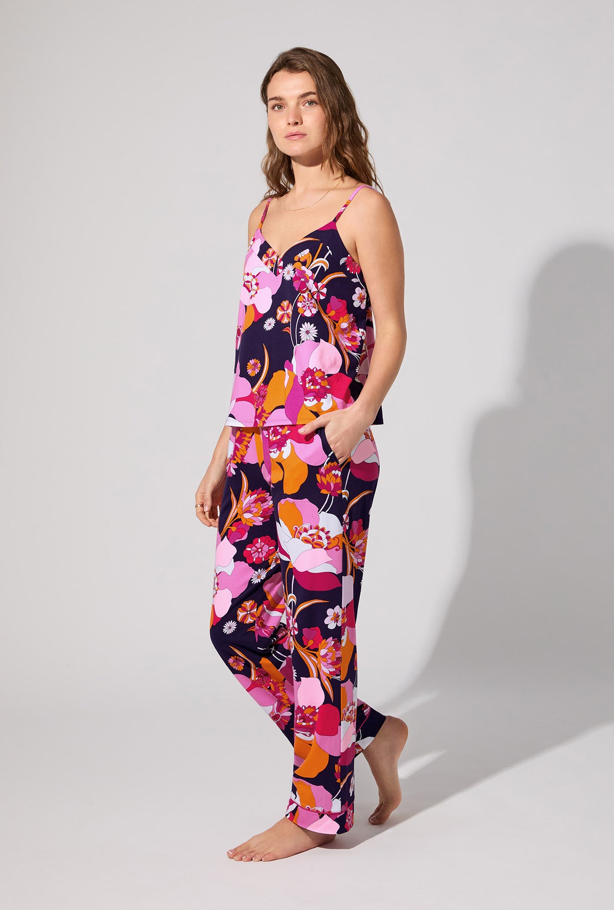 A lady wearing BedHead X Trina Turk Floral Medley Cami Tank Stretch Jersey Long PJ Set