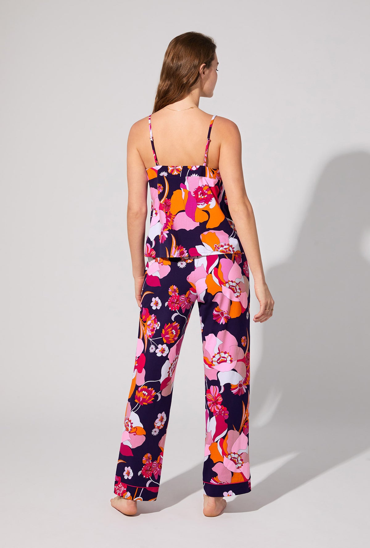 A lady wearing BedHead X Trina Turk Floral Medley Cami Tank Stretch Jersey Long PJ Set
