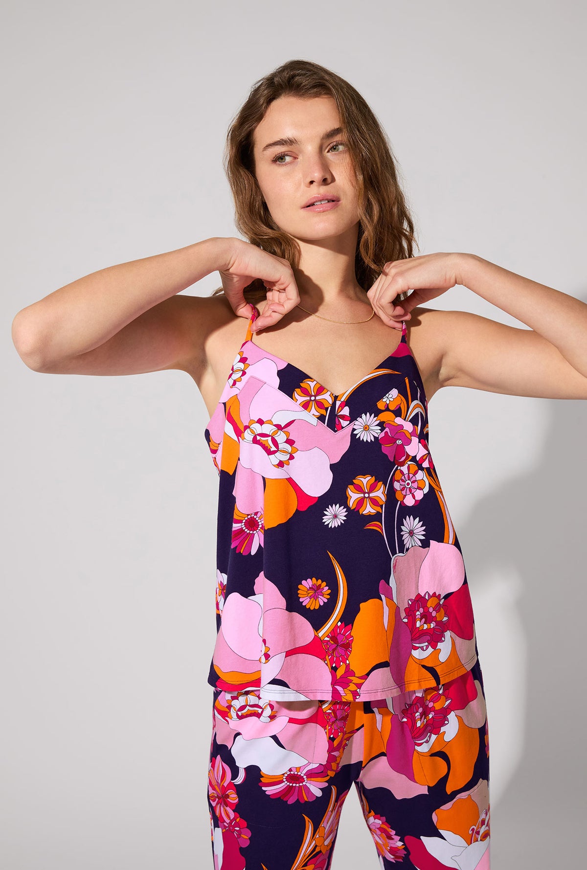 A lady wearing BedHead X Trina Turk Floral Medley Cami Tank Stretch Jersey Long PJ Set