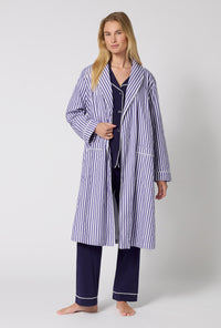 A Lady Wearing Navy Signature Stripe Lined Woven Cotton Sateen Robe posing with one hand placed at the robe