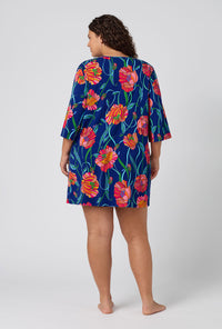 A Lady Wearing Plus Size BedHead x Trina Turk Linear Poppy Stretch Jersey Sleep Dress in a back view pose